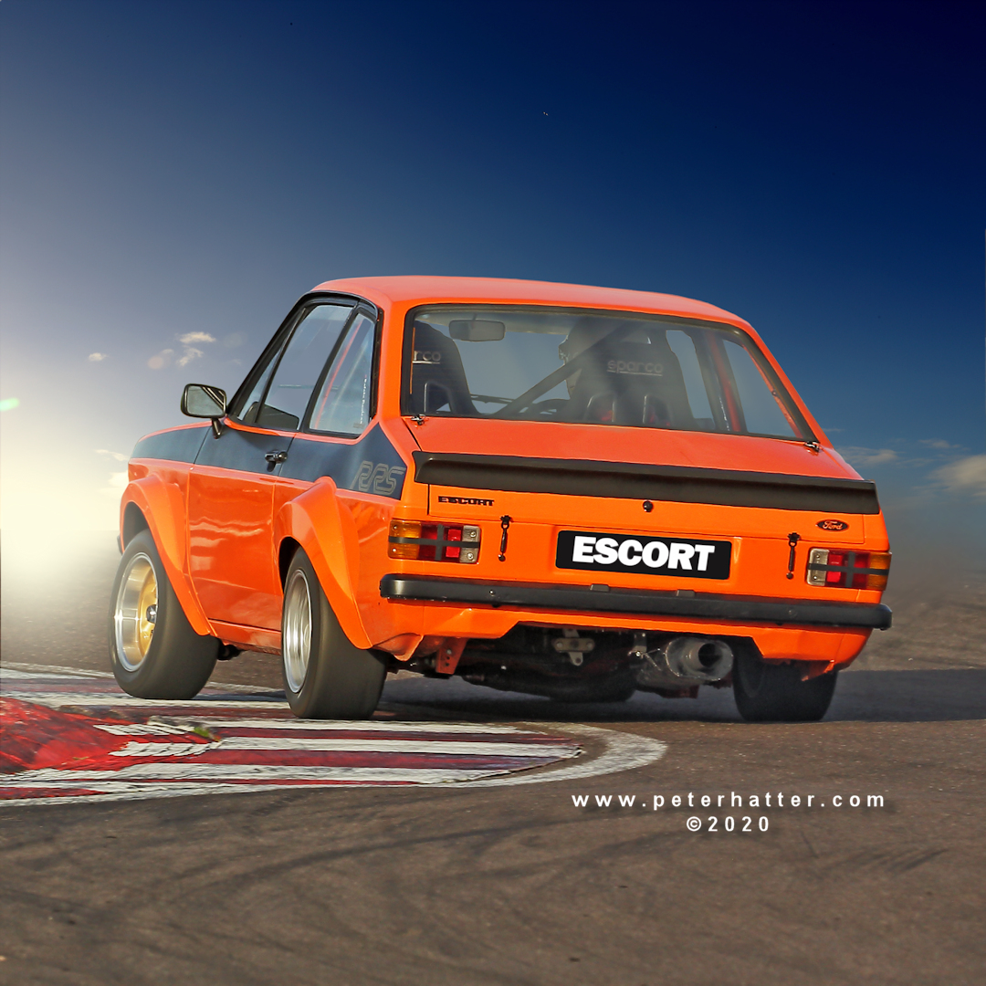 A Ford Escort mark 2 testing the limits of its suspension at Donington Park.