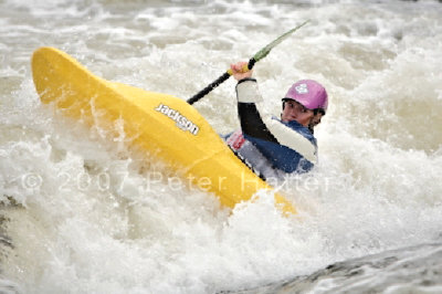 Sports photography example of white water canoe action.