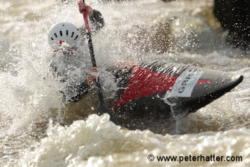Sports photography example of white water canoe action.